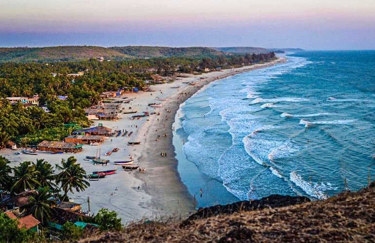 The North Goa coastline curving away into the haze
