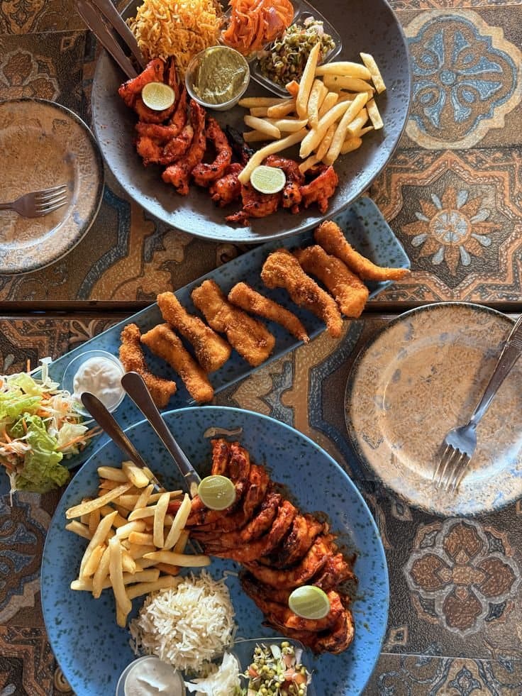 A Goan platter — grilled catch, spiced sides and chips