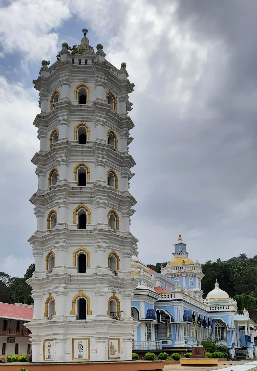 The tiered white tower of a Goan temple